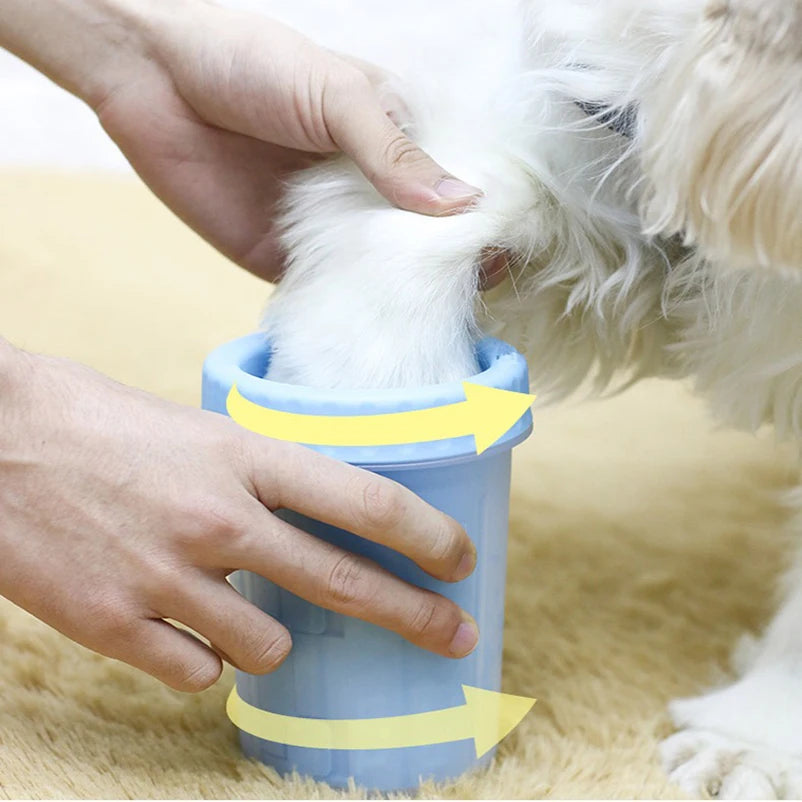 Dog paw being cleaned in a blue pet paw washer cup, Pawvero pet grooming accessory